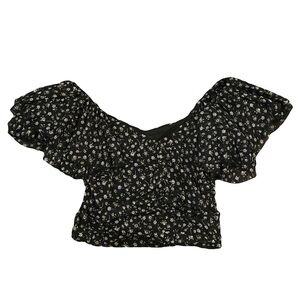 Large black and white floral blouse with ruffled sleeves